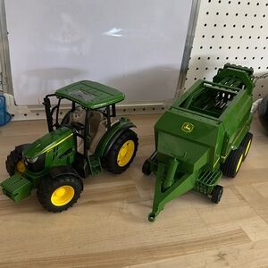 Bruder tractor with hay baler attachment and hay